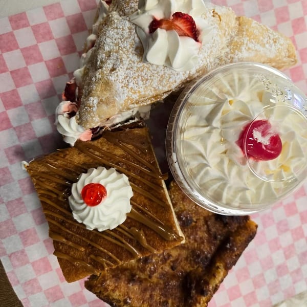 Assortment of Sweet Antojito bakery desserts, including a pastry, a caramel bar, and a whipped cream cup.