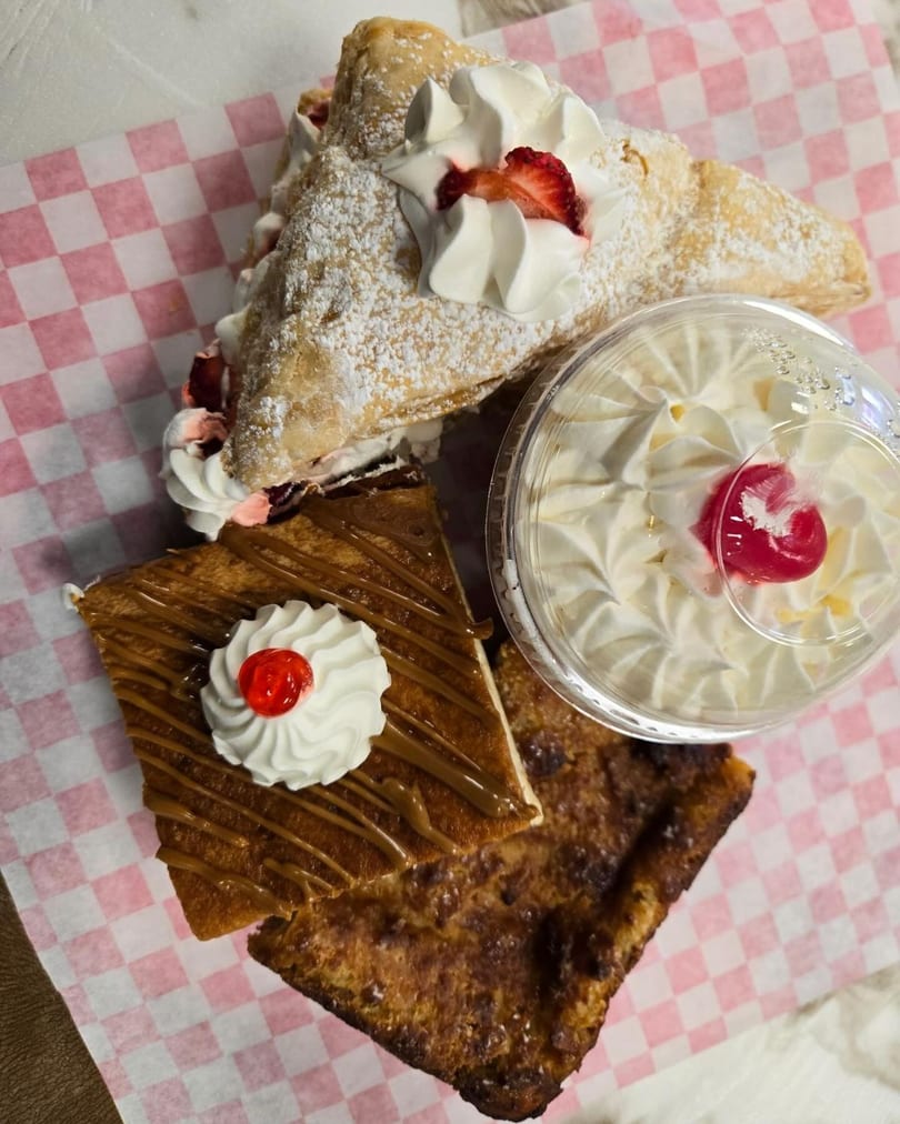Assortment of Sweet Antojito bakery desserts, including a pastry, a caramel bar, and a whipped cream cup.